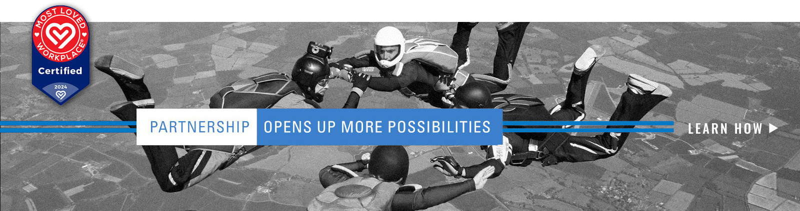 Four people parachuting out of a plane in formation, with the text "Partnership opens up more possibilities" laid on top of it